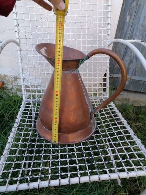 large copper water jug
