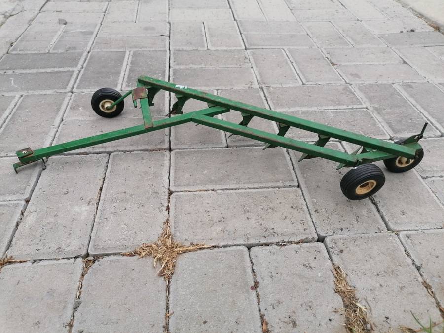 Vintage metal plow toy