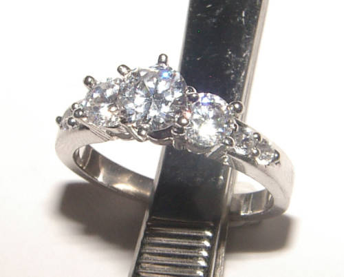 PURE PERFECTION! SOLID .925 STERLING RING WITH SIMULATED DIAMONDS!