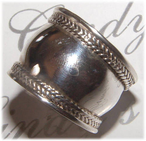 BROAD SOLID STERLING SILVER BALI RING.