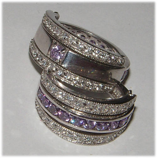 EXTRAORDINARY ITEM! - REVERSABLE LAVENDER CZ AND DIAMOND SIMULANT STERLING SILVER RING.