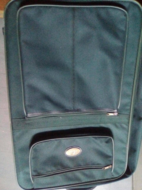 Green Duigui suit case on wheels