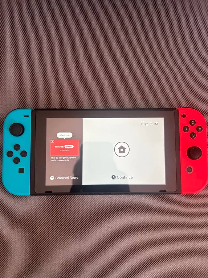 Nintendo Switch V2 Neon Red / Neon Blue + 1 Game
