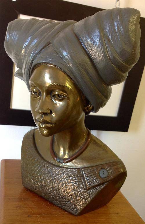 Casper Derare. Died 2001. Large numbered sculpture of African woman.