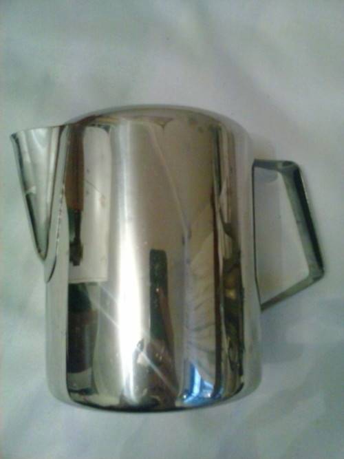 Stainless steel water jug, holds 750ml. Excellent condition. 12 cm high, 9cm dimeter.