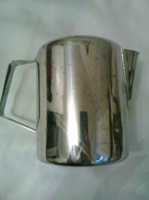 Stainless steel water jug, holds 750ml. Excellent condition. 12 cm high, 9cm dimeter.