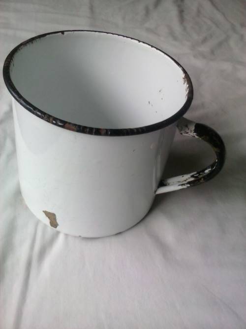 Large enamel jug, slightly damaged, white with black trim, 14.5cm high x 16cm diameter