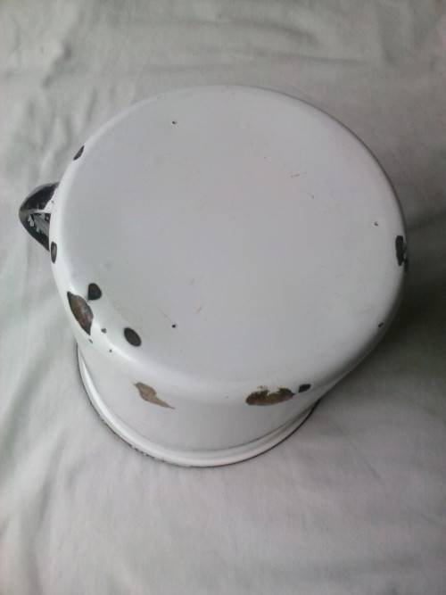 Large enamel jug, slightly damaged, white with black trim, 14.5cm high x 16cm diameter