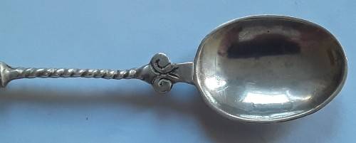 An antique solid silver spoon with figural finial. Arthur Graf, London, 1911.