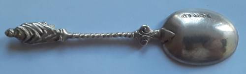 An antique solid silver spoon with figural finial. Arthur Graf, London, 1911.