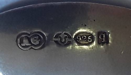 An antique solid silver spoon with figural finial. Arthur Graf, London, 1911.