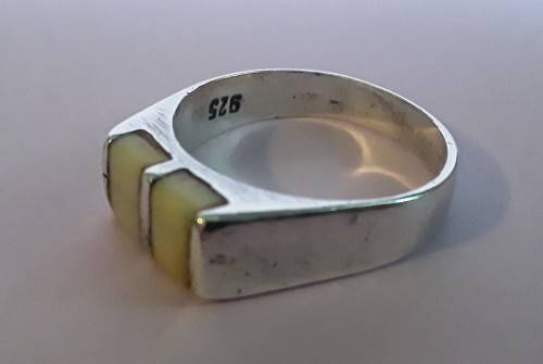 Solid sterling silver ring with lovely cream coloured stones