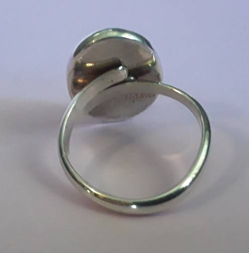 Silver ring with lovely large stone.  Adjustable band