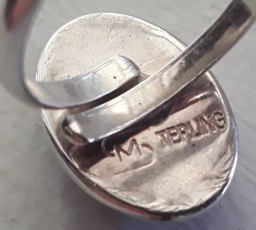 Silver ring with lovely large stone.  Adjustable band