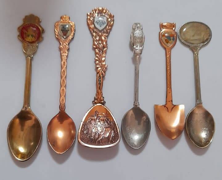 Vintage collectable spoons on wall stand