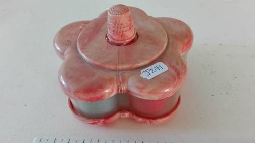 very attractive container with cottons and thimble on the top, as per photo