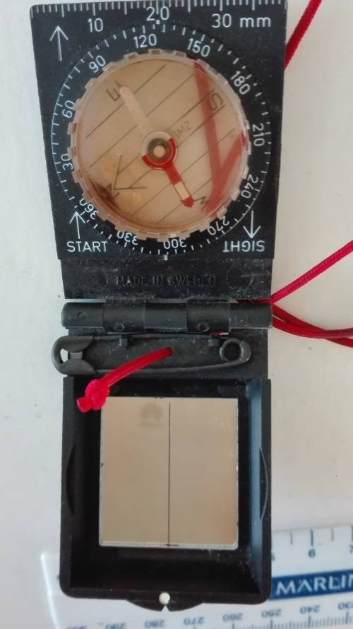 interesting handheld compass, opens up, has mirror.............,as per photo