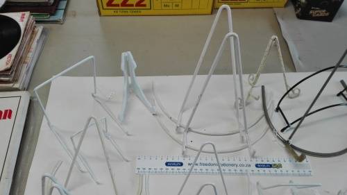 box of plate stands, 29, some are chipped and peeling, and four plate hangers, as per photos