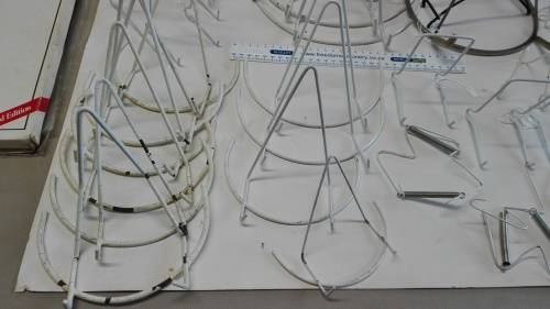 box of plate stands, 29, some are chipped and peeling, and four plate hangers, as per photos