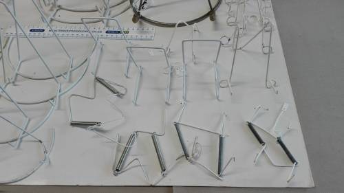 box of plate stands, 29, some are chipped and peeling, and four plate hangers, as per photos