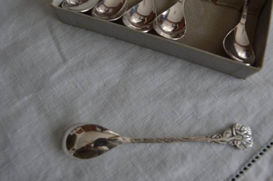 6 silver plated demitasse teaspoons with a different flower on the end of each handle,Very pretty !