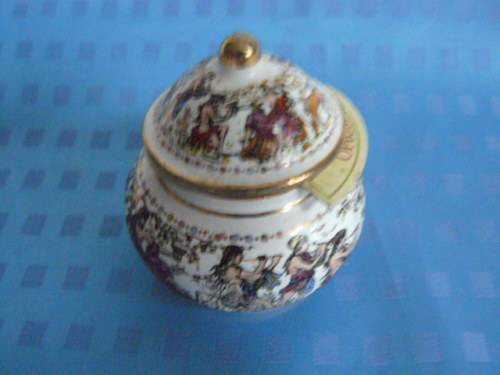 OPIUM CERAMIC PERFUME BOTTLE SOME CONTENTS