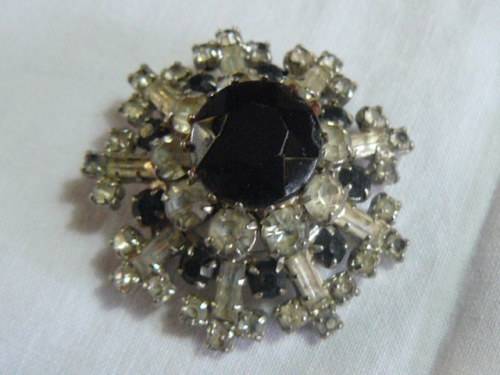 RAISED SLVER TONED BROOCH WITH BLACK STONED AND BLING