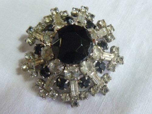 RAISED SLVER TONED BROOCH WITH BLACK STONED AND BLING