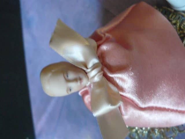 PIN CUSHION LADY WITH PORCELAIN HEAD AND A FREE THIMBLE