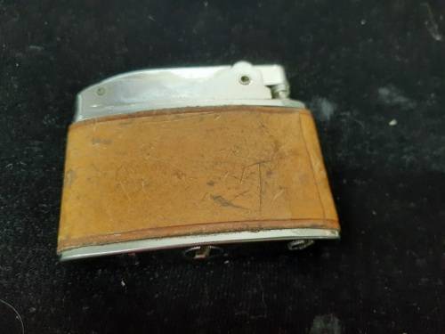Omega engraved lighter