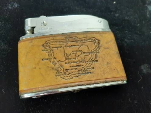 Omega engraved lighter