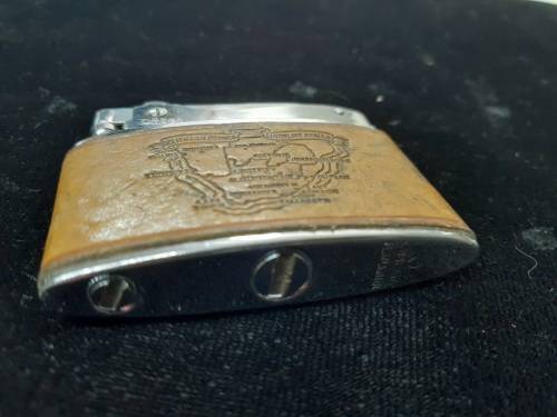 Omega engraved lighter