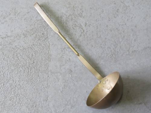 Yellow copper antique soup ladle