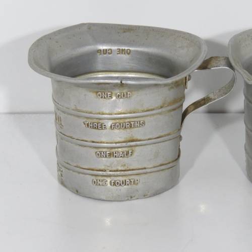 Pair of vintage Aluminium Royal measuring cups