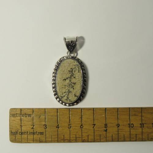 Sterling silver pendant with fossil inlay