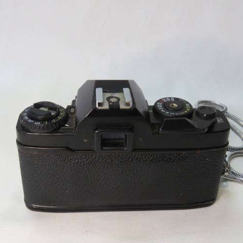 Ricoh KR-10 camera in pouch with Rikenon 1:2 50 mm lens and booklets