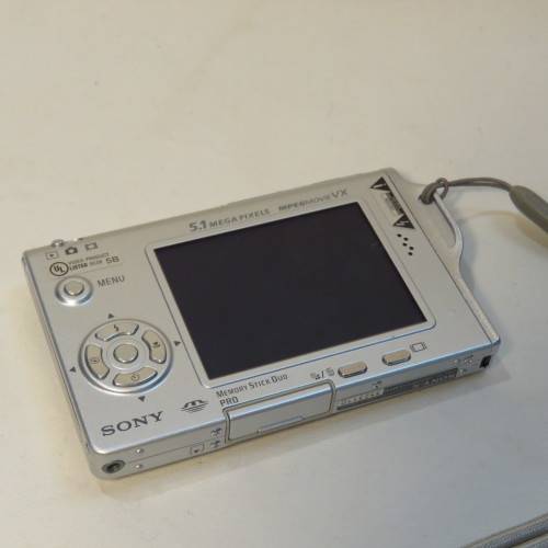 Sony DSC 17 digital still camera with books, stand, case, cables and 128 MB memory card