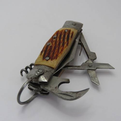 Small vintage pocket knife with corkscrew, Scissors, tin opener and blade - Unusual