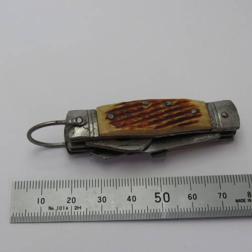 Small vintage pocket knife with corkscrew, Scissors, tin opener and blade - Unusual