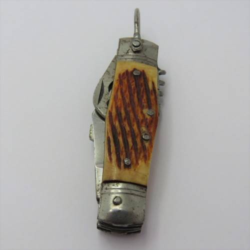 Small vintage pocket knife with corkscrew, Scissors, tin opener and blade - Unusual
