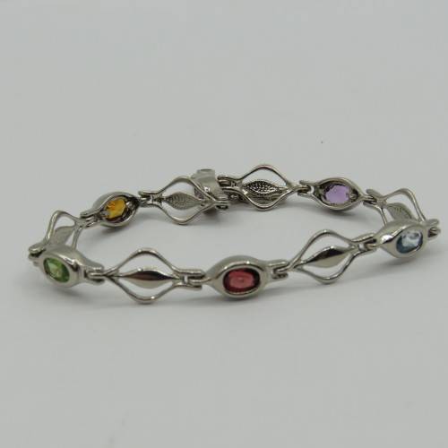 Lot of 5 silver look alike bracelets with colored stones - never used