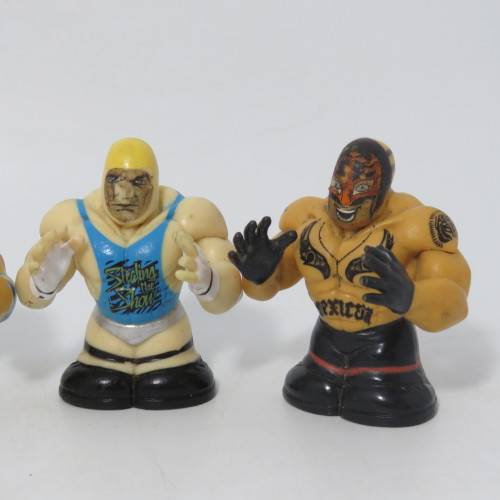 Set of 4 Wicked cool WWE wrestling Thumbpers figurines