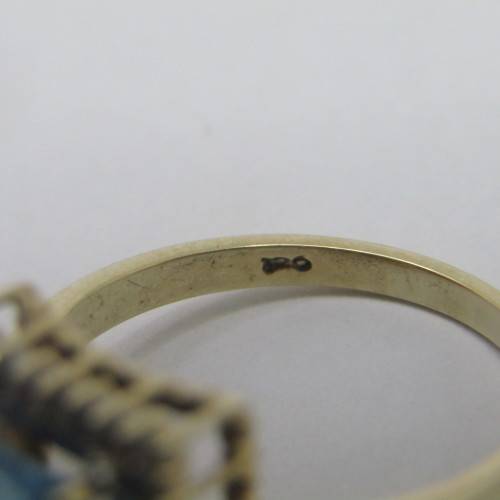 9kt Gold ring with 3.5ct blue topaz and small diamonds of 0.28ct in total - weighs 4.8g - size O/7
