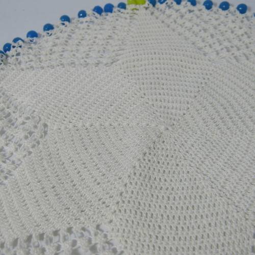 Old doily with blue and yellow beads handmade