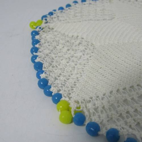 Old doily with blue and yellow beads handmade