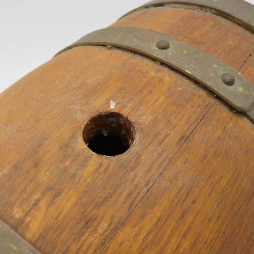 Vintage wooden wine barrel on stand with brass tap