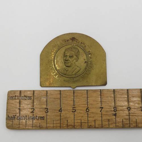 Small brass plate with Nelson Mandela unsure of origin