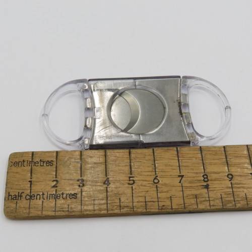 Plastic and metal cigar cutter