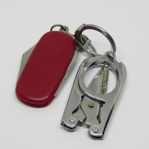 Vintage pocket knife and opener with pocket scissors