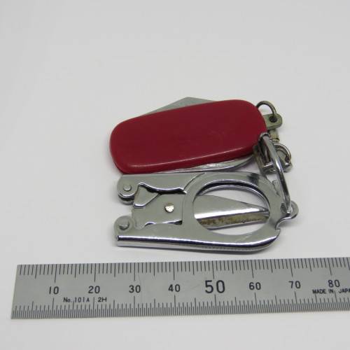Vintage pocket knife and opener with pocket scissors